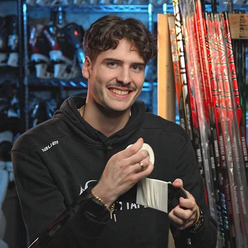 Logan Cuvo holding white hockey tape during START UP Season 14.
