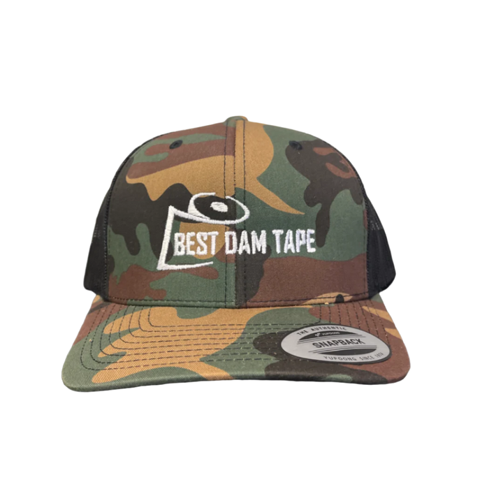 A camo snapback hat with a logo on the front reading 'BEST DAM TAPES'.
