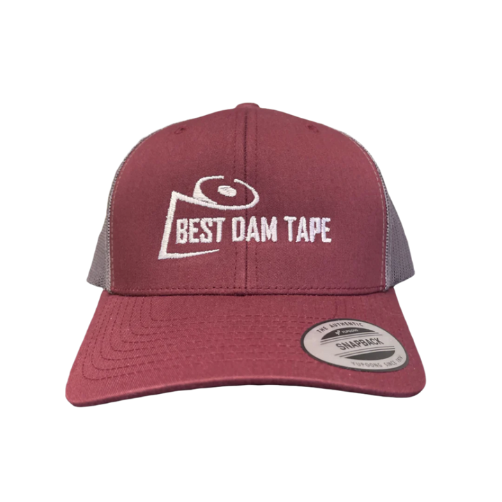 A maroon and grey snapback hat with the text 'BEST DAM TAPE' embroidered on the front.