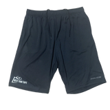 A pair of black athletic shorts with a logo on the left leg and a smaller text logo on the waistband.