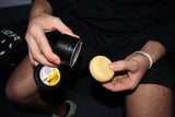 Best Dam Wax hockey wax tin and applicator against dark background