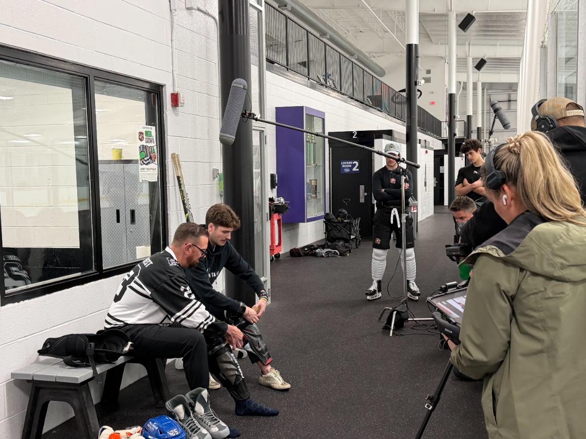 Film crew shooting Best Dam Tape at a rink