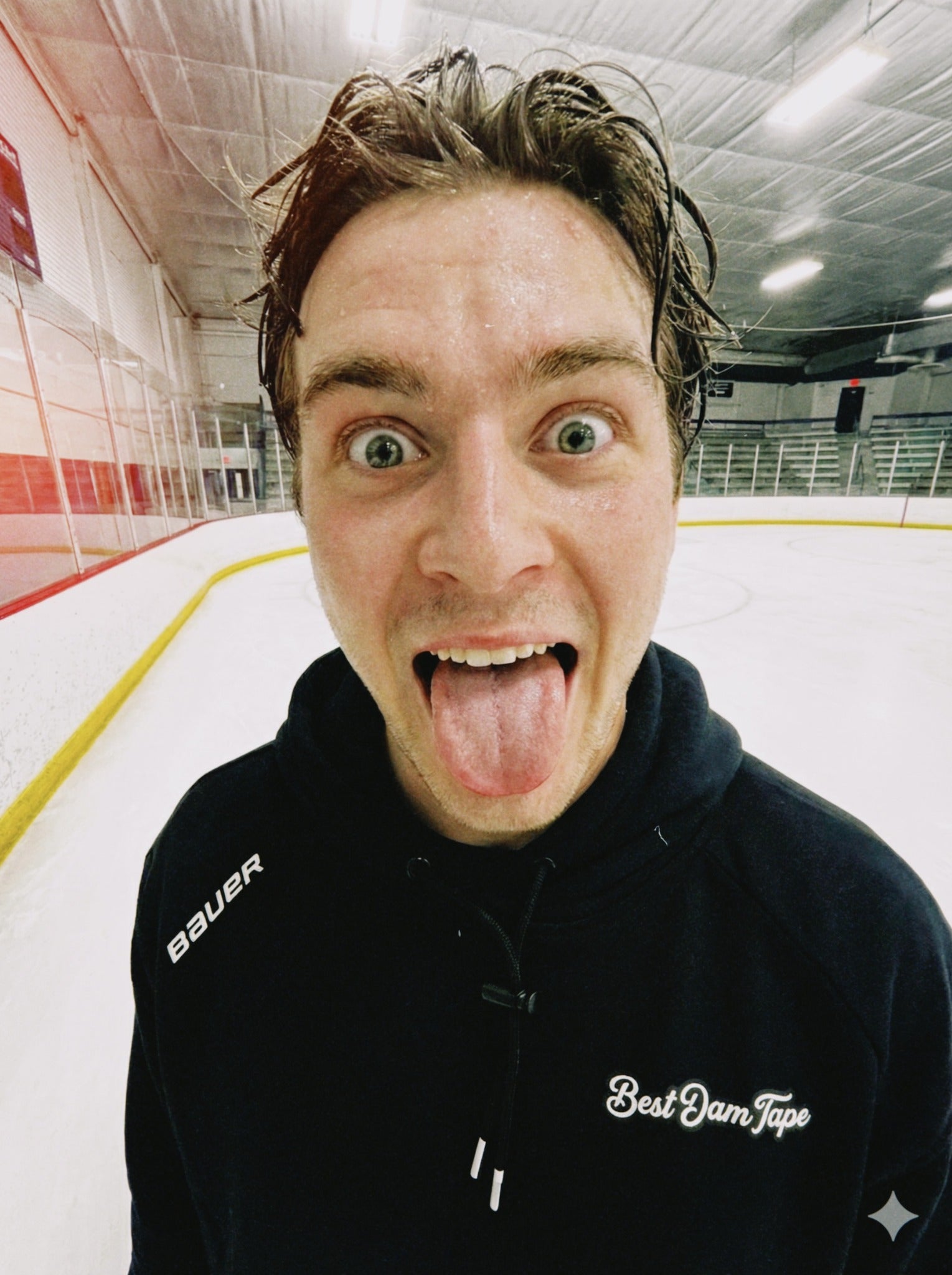 Best Dam Tape teammate at the ice rink wearing a branded hoodie